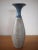 Large and heavy floor vase signed KIRK; ribbed design with speckles. Approximate dimensions: 19" high, 6.5" wide...