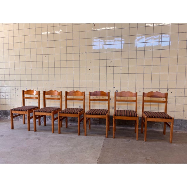 This beautiful set of six Scandinavian dining chairs is crafted in solid pine and showcases an elegant, well-balanced...