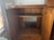 Sturdy wood armoire from the Ethan Allen Country French collection. This piece has a warm brown finish with ornate brass-...