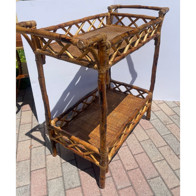 Just in, this quite large Mid Century Burnt Bamboo Two Tier Gallery Bar Cart. This cart does not have wheels.The pop and...