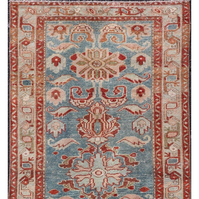 Measures: 3'1" x 6'3" This exquisite antique Persian Hamadan rug, dating back to circa 1920, measures 3'1" x 6'3"....