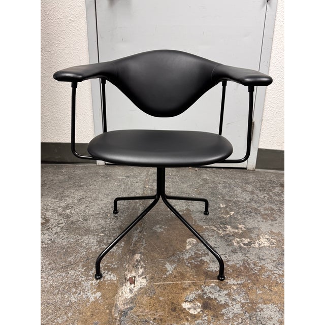 Design Plus Gallery presents the Meeting Chair by GamFratesi for Gubi. The Masculo swivel chair has a sculptural form with...