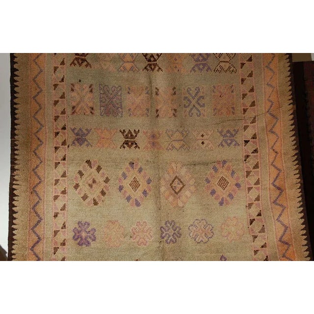 Large handwoven vintage Moroccan Berber Tribal rug, nicely aged and faded with sage, purples, browns and oranges cors....