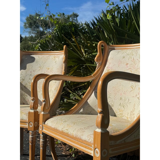 Elegant and beautifully detailed pair of Harris Marcus French Empire-style armchairs, featuring exceptionally graceful...