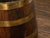 An English Victorian period wooden oval shaped barrel from the 19th century with painted coat of arms and brass braces....