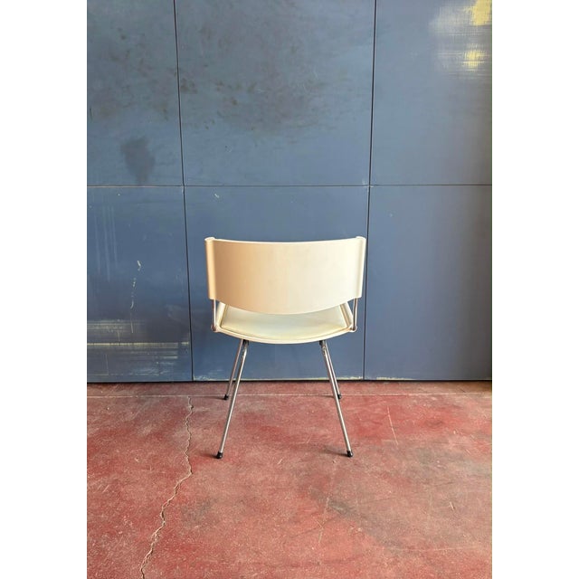 The "ND150 Badminton" chairs are made in chromed tubular steel and the backrest and seat are in wood lacquered white with...