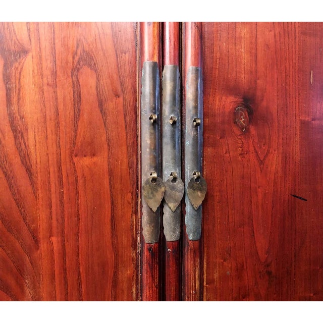 This Antique Chinese Ming Cabinet is handcrafted in an elegant Ming style. All the frames of the cabinet are carved with...
