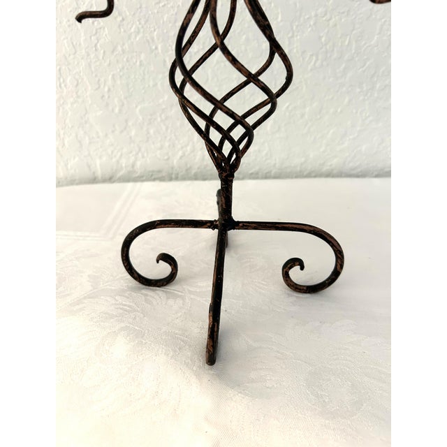 Vintage forged iron tall pillar candle holder in a celestial sun motif. Black and a shade of bronze featuring a glass...