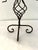 Vintage forged iron tall pillar candle holder in a celestial sun motif. Black and a shade of bronze featuring a glass...