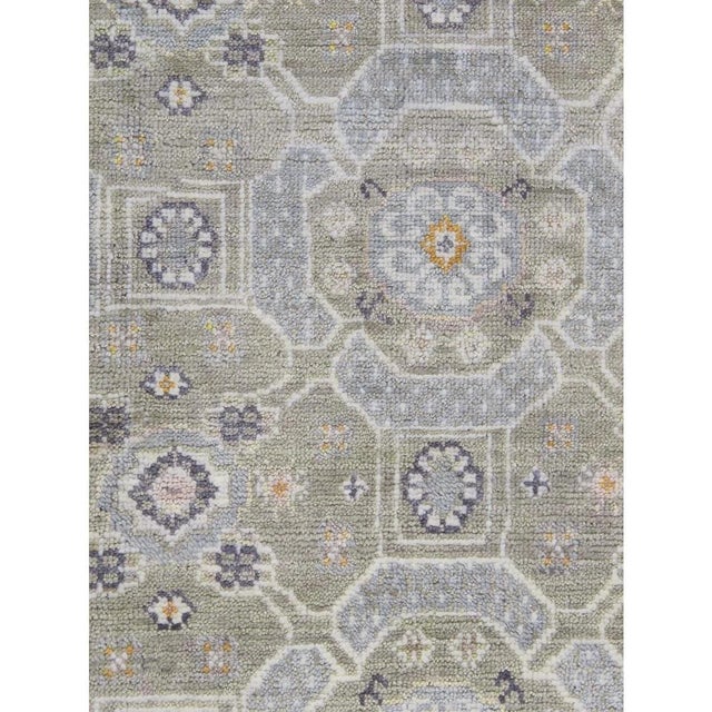 This exquisite Khotan rug is a masterpiece of traditional craftsmanship. Hand-knotted from 100% premium wool, it showcases...