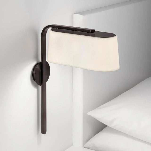 This Wall Light Features A D-ended Rectangular Shade Which Is Enclosed At The Top With A Metal Reflector Plate.