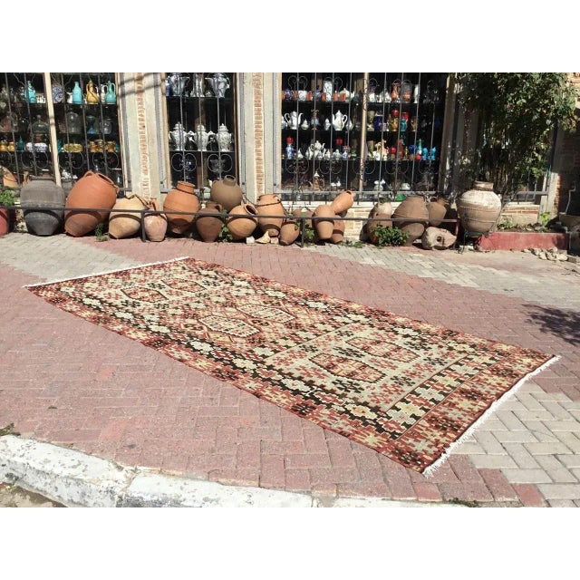 This beautiful, vintage, handwoven kilim is approximately 70 years old. It is handmade, of very fine quality hand spun...