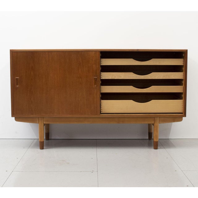 1950s Danish teak model 160 sideboard designed by Børge Mogensen for Søborg Møbelfabrik. The sideboard contains 4...