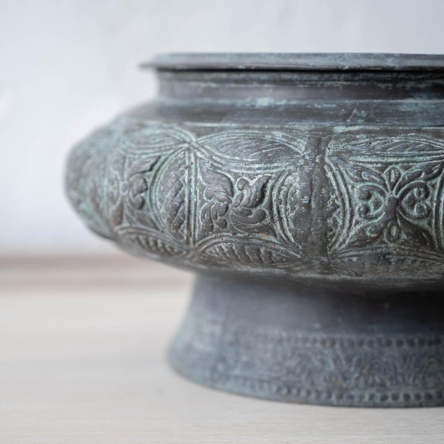 Cast bronze lengguai of compressed bulbous form with flared foot from Brunei, finely incised around the body with...