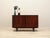 The cabinet was made in the 1970s by the renowned Danish manufacturer Omann Jun. The structure is covered with rosewood...