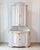 A Swedish Gustavian period two-part corner cabinet from the late 18th century, designed to maximize space while...