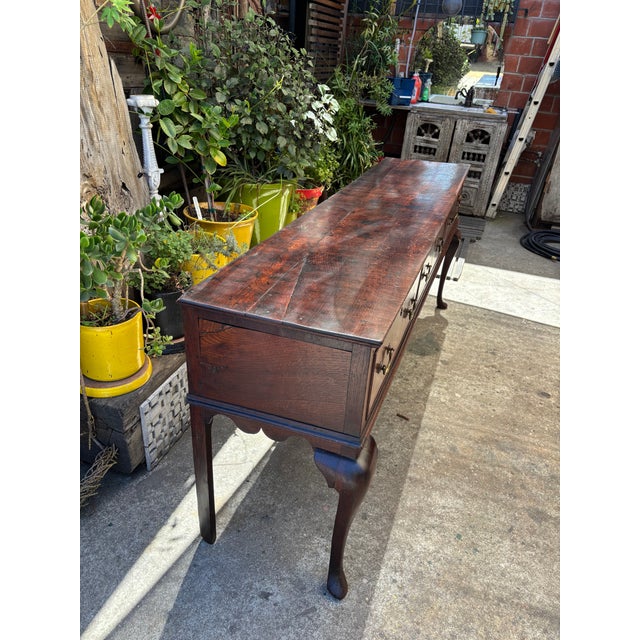 Pretty 18th century English three drawer period oak sideboard dresser base on cabriole legs. Good colour. Impeccable...