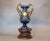 This Neoclassical wine themed antique glazed and hand painted ceramic wine jar, vase, decanter was made in France, circa...