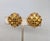 1960s goldtone square cut faux-citrines with small round faux-topaz accents clip earrings. Marked crown "TRIFARI ©" on the...