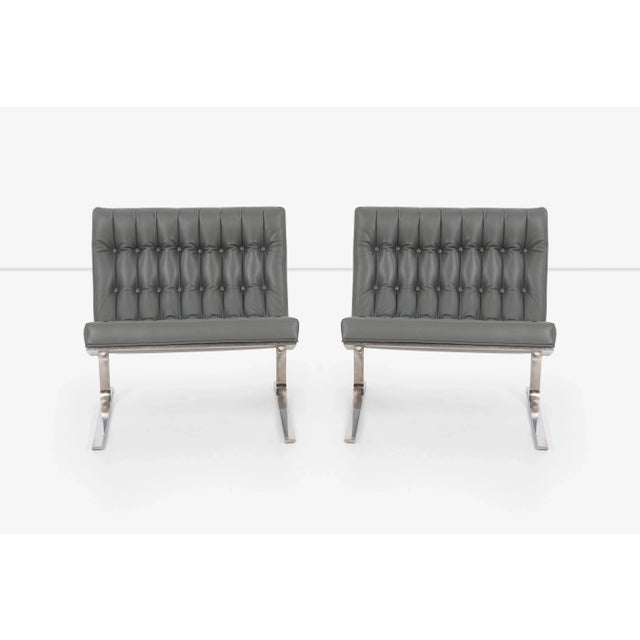 Nicos Zographos 1959 CH28 Lounge Chairs; Solid cantilevered stainless steel frame, reupholstered, tufted and channeled...