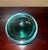 Substantial emerald green cased art glass bowl attributed to Murano, Italy. This striking decorative piece features deep...