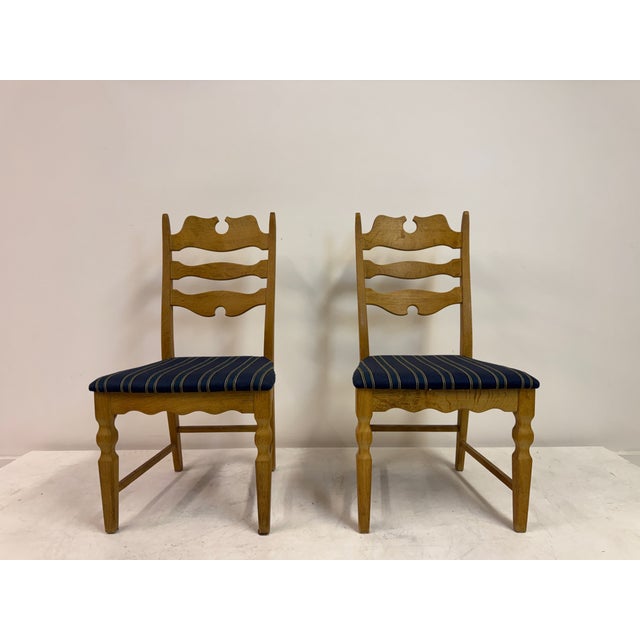 Set of Six “Razorblade” Dining Chairs by Henning Kjaernulf, Oak, 1960s A striking set of six oak dining chairs by Danish...