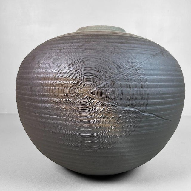 A stunning, handcrafted ikebana flower vase from the renowned Echizen Hatayama kiln, created in the 1960s. This impressive...