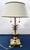 This commanding mid-century Hollywood Regency table lamp, designed in the distinguished manner of Frederick Cooper and...
