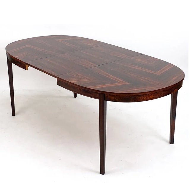 Rosewood dining table with one leaf for extension. Apparently unmarked. Dimensions: H 28.5" x W 59" x D 39.5" (Leaf) W...