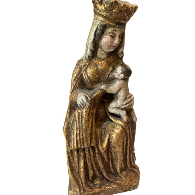 Beautiful antique Madonna and Child, France. It is made of terracotta with a gilded finish.