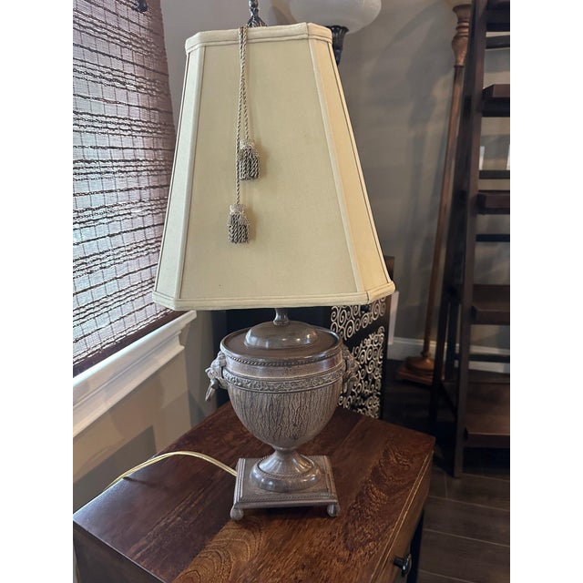Vintage John Richard Neoclassical Lion Head Urn Lamp with Tassel Shade This substantial John Richard Neoclassical urn lamp...