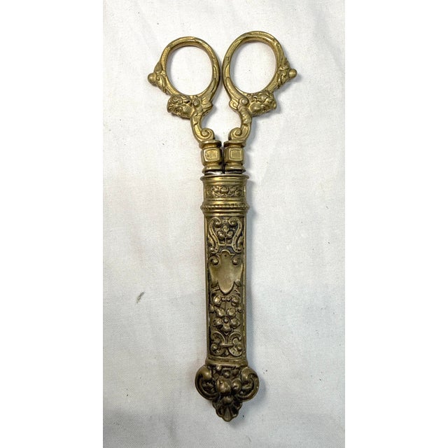 Up for sale is an exquisite antique pair of 19th century Victorian sewing scissors, featuring brass handles and sheath....