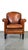 This charming vintage armchair has a warm color and is made of sheepskin. It fits easily into almost any interior and...