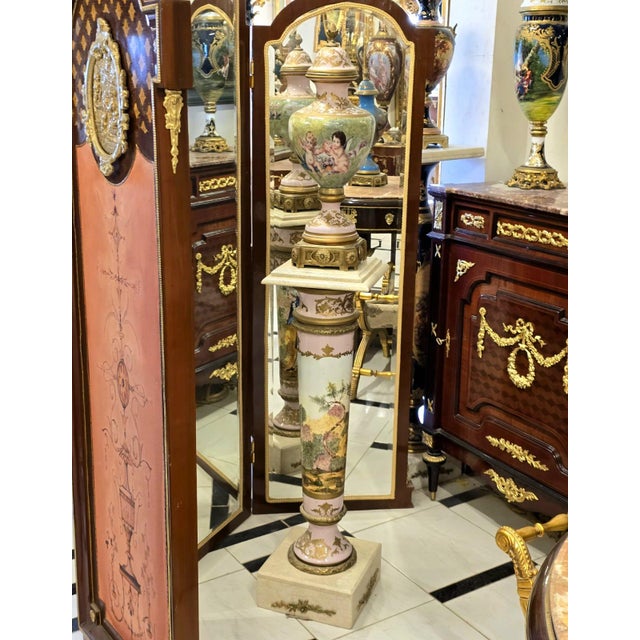 Bring timeless romance and French elegance into your home with this exquisite Sèvres-inspired vase and pedestal set,...