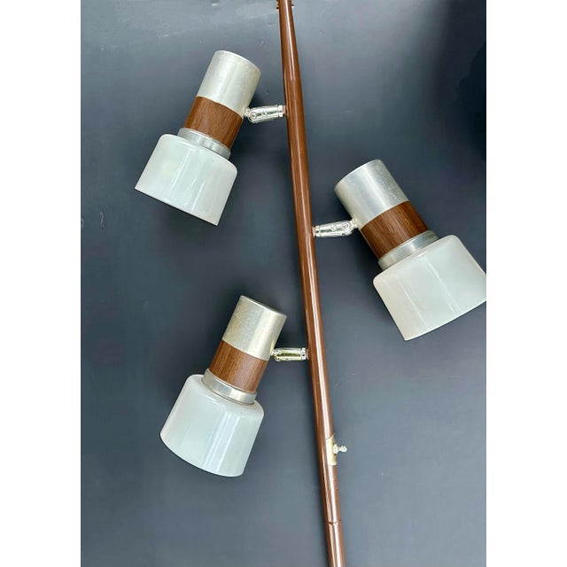 Midcentury modern floor lamp featuring three adjustable cylindrical shades, attributed to Gerald Thurston for Lightolier....