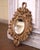 Decorate a powder room, a study or hallway with this heavily carved antique mirror. Created in France circa 1880 and...
