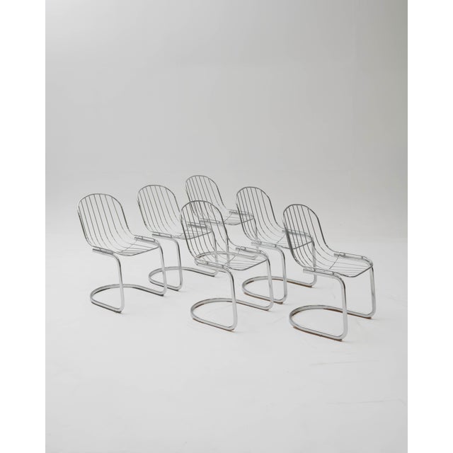 This set of tubular chairs, designed by renowned Italian designer Gastone Rinaldi, is an elegant example of mid-century...