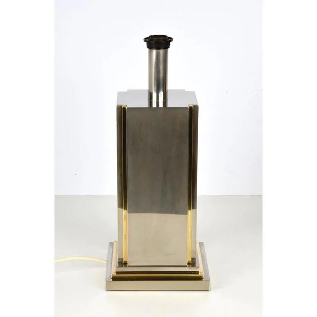 Amazing Mid-Century steel and brass table lamp in steel and brass. This fantastic piece was designed by Carlo Venturini...