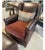 Handcrafted in dark brown leather with a plush upholstered seat cushion, wingback silhouette, and coordinating ottoman....