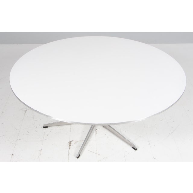 Piet Hein & Arne Jacobsen sofa table with new lacquered plate. six star base of aluminium and steel. Made by Fritz Hansen....