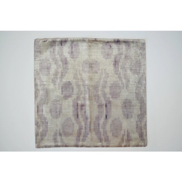 Whimsical Silk Velvet accent pillow with a patterned ikat fabric for the back. Pillow front features purple organic...