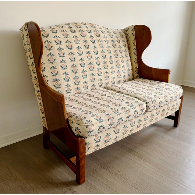 The most darling vintage wingback settee or loveseat by Stickley for its "Connecticut Valley" collection. The settee is...