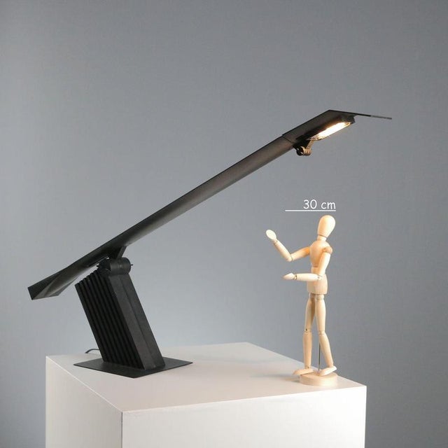 Condor' table lamp designed by Hans von Klier for Bilumen in 1988, made entirely of black metal. The minimalist and...