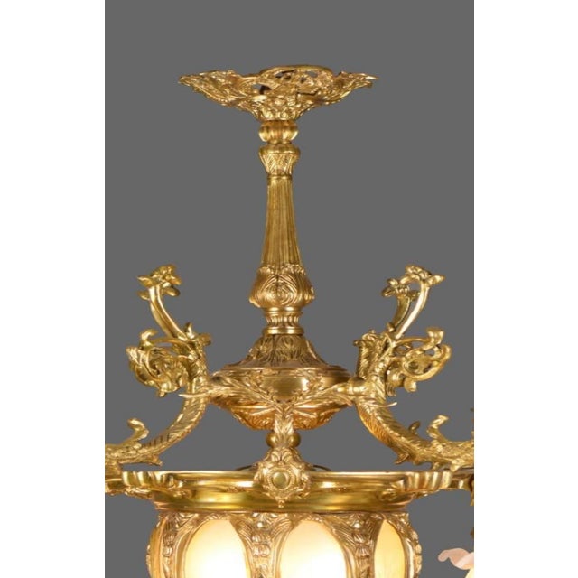 A luxurious contemporary French Louis XVI-style gilt bronze and crystal chandelier, handcrafted with refined neoclassical...