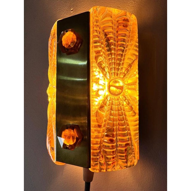 This original Vitrika wall lamp from Denmark combines mid-century charm with exceptional materiality. The two textured...