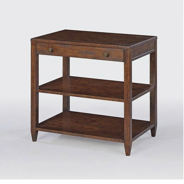 Classic wide rectangle side table with a drawer, two shelves, brass hardware, and tapered feet, has a “country” mahogany...