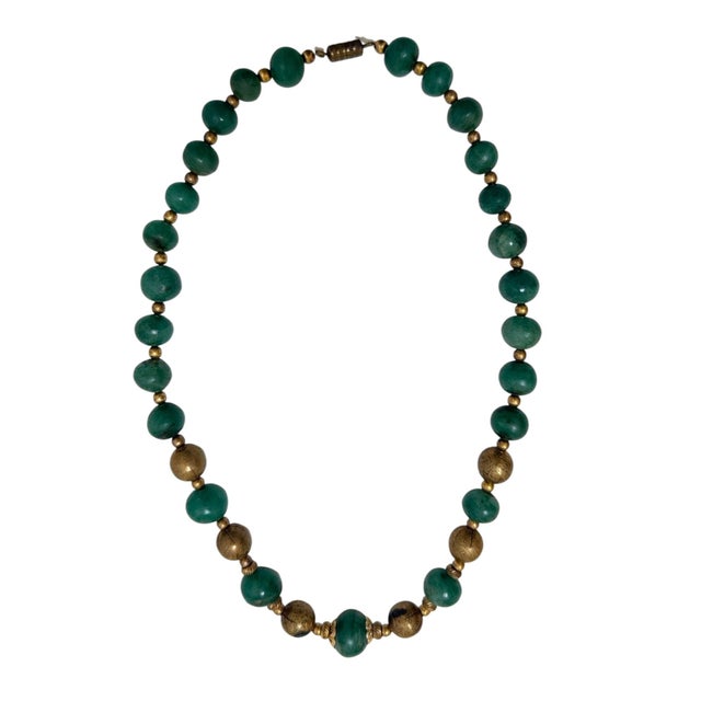 This stunning necklace features jade beads paired with decorative brass filigree accents and a screw-barrel clasp. Early...