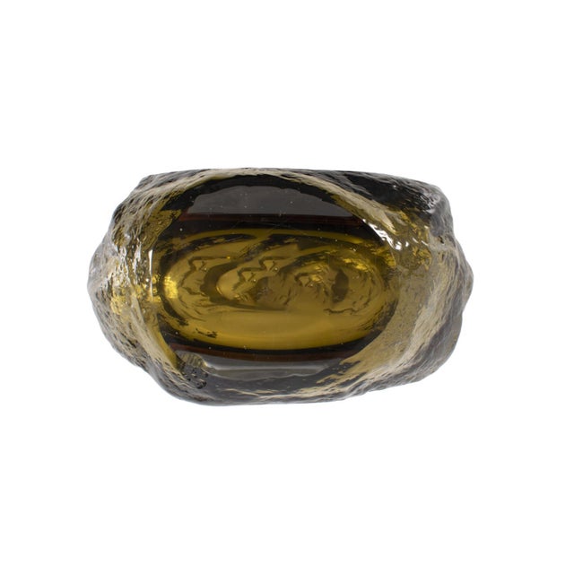 Featuring a sleek design and colorful tones, this piece stands out with its fluid, textured shape, making it a...