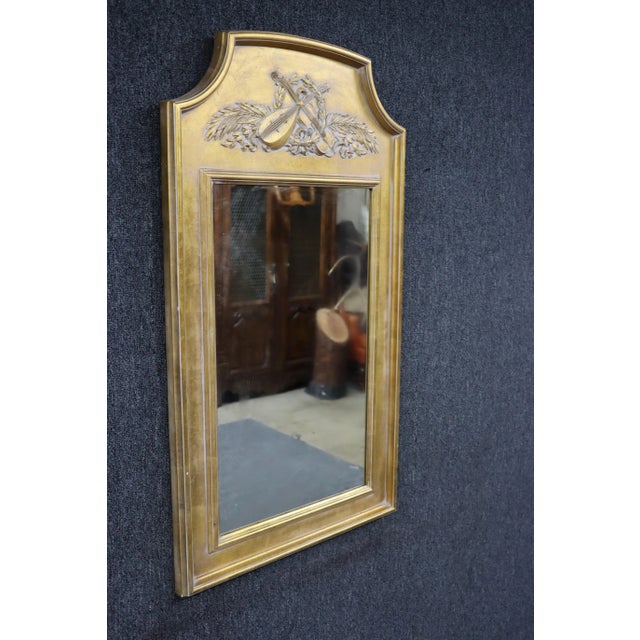 Gold gilded laurel wreath and violin carved mirror