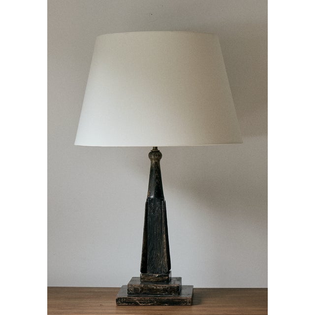 Vintage black wooden table lamp with a heavy patina. This rustic wooden lamp has a bronze stem, has been newly re wired to...